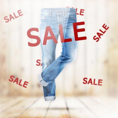 Beyaz ahşap plakalar arka plan üzerinde kot pantolon