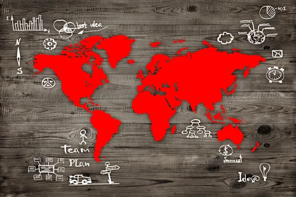 World map with business sketches over wood background