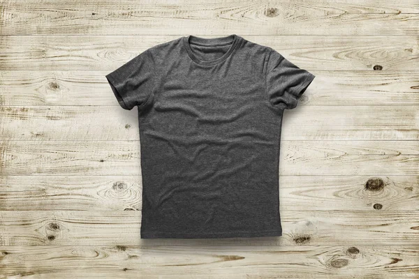 Grey shirt over wood background — Stock Photo, Image