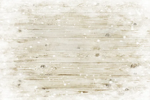 La textura de madera marrón con copos de nieve sobre ella. Fondo de invierno —  Fotos de Stock