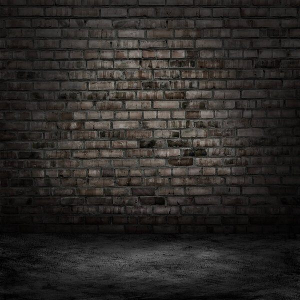 Dark room with tile floor and brick wall background