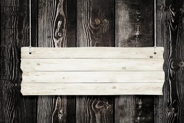 Signo de madera con cuerdas aisladas sobre tablones de fondo — Foto de Stock