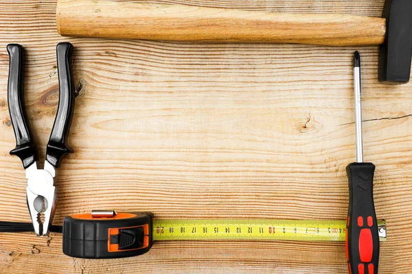 Close up tools on a wooden background Royalty Free Stock Images