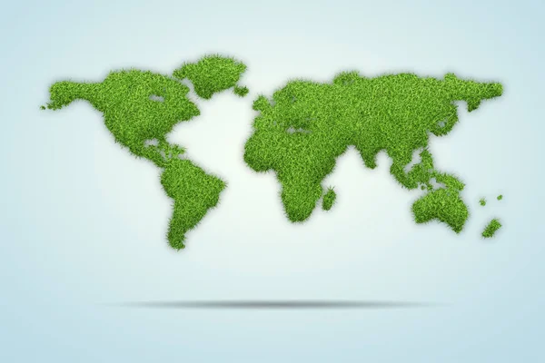 Mapa světa tvar zelené trávy izolované na modrém pozadí — Stock fotografie