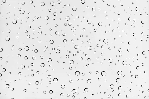 Gotas de agua sobre fondo de vidrio —  Fotos de Stock