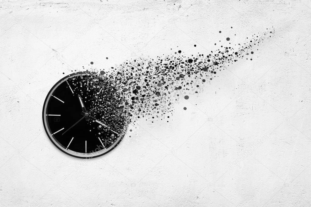 Classic clock on white concrete background disintegrate in a small parts and flying away. Time flying concept