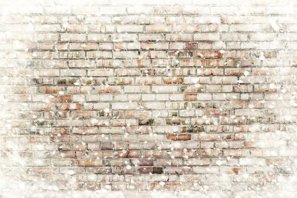 The brick wall texture with snow flakes over it. Winter background — Stock Photo, Image