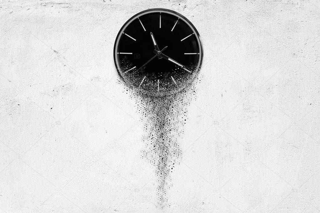 Classic clock on white concrete background disintegrate in a small parts and flowing away. 