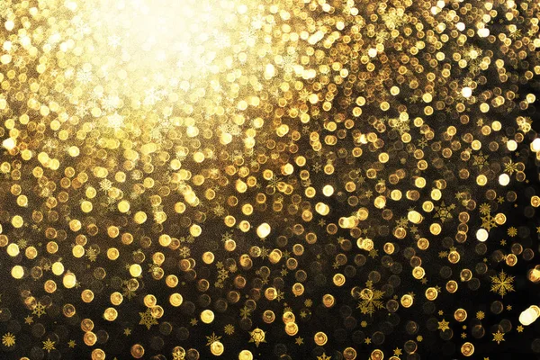雪フレーク背景を持つ抽象黄金ボケ — ストック写真