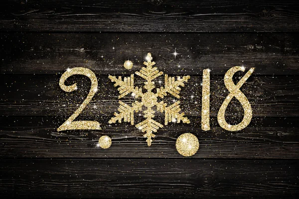 Gouden glitter 2018 sneeuwvlok op zwarte achtergrond. Kerstkaart — Stockfoto
