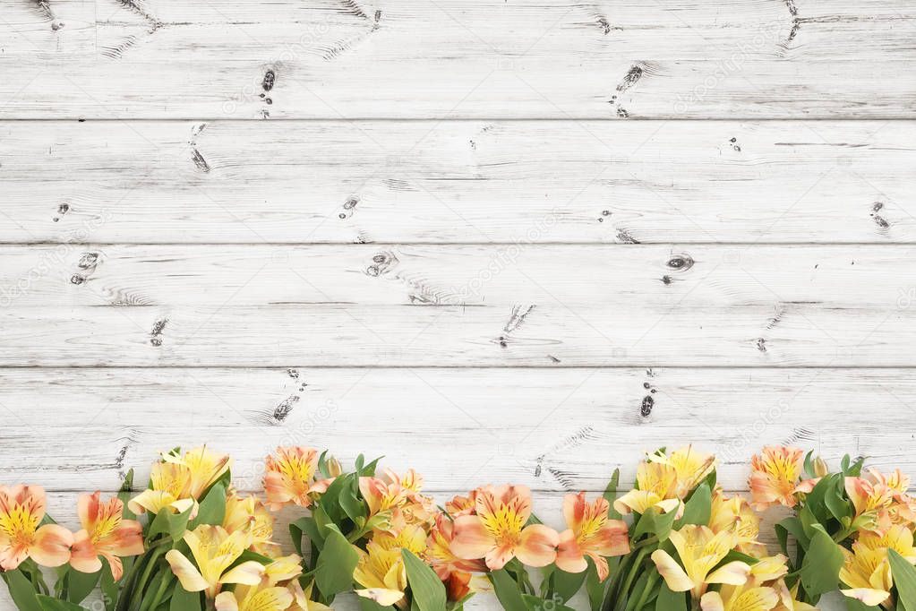 Beautifull flowers over wood planks background