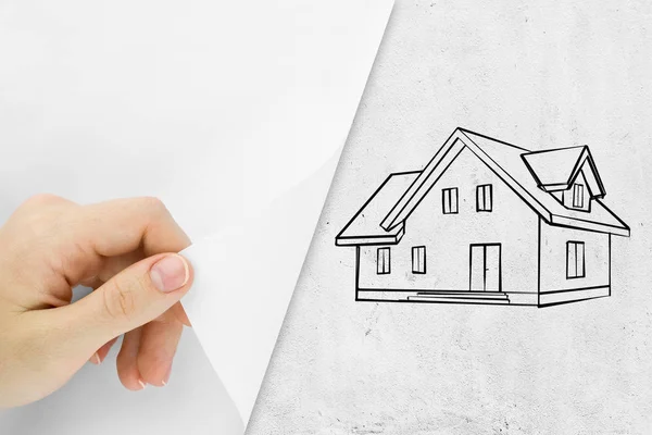 Blank sheet of paper with hand opening it. Over house sketch background — Stock Photo, Image