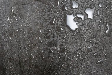 yağmur damlaları içinde gri granit granit dokulu ve su drops.back
