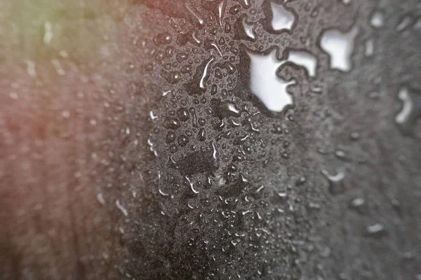Granito cinza em gotas de chuva, textura de granito com gotas de água.back — Fotografia de Stock