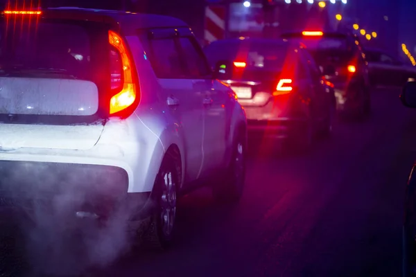 Air pollution machines standing in traffic early in the morning — Stock Photo, Image