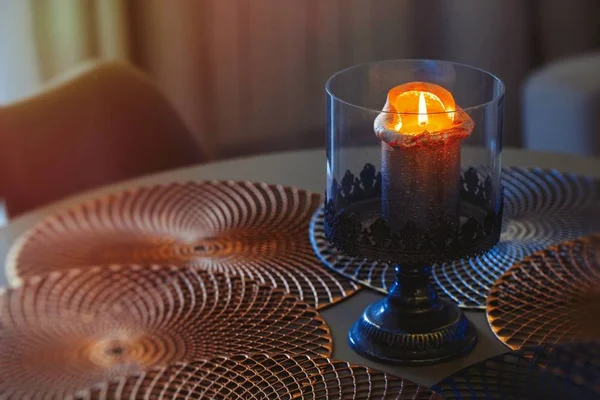 Burning candle on the table close-up — Stock Photo, Image