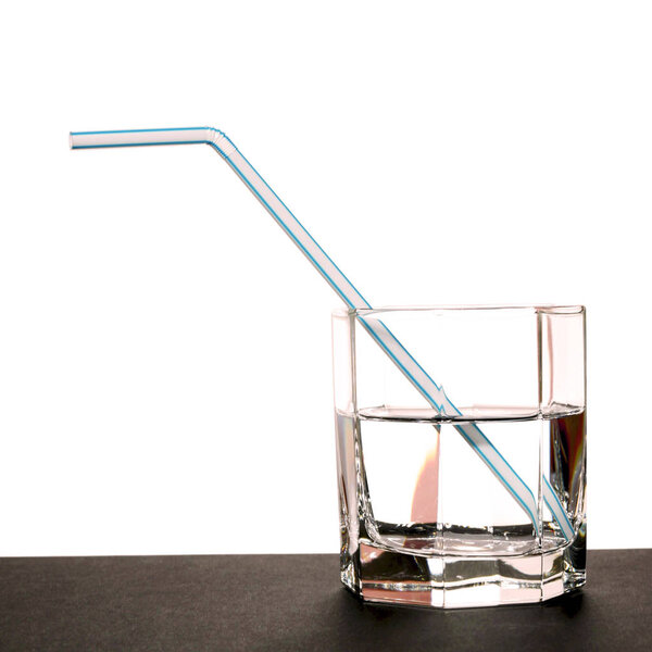 straw in a glass of water