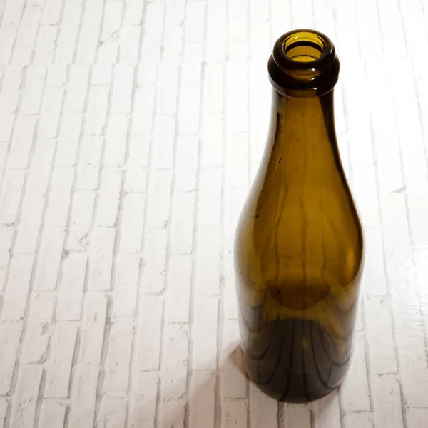 empty wine bottle vertically