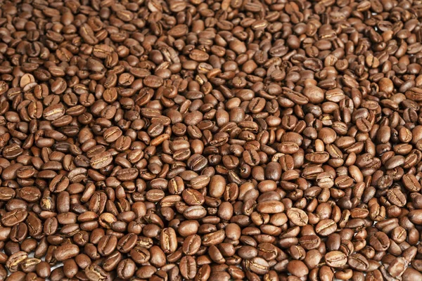 Hintergrund aus Bohnen geröstete Kaffeebohnen — Stockfoto