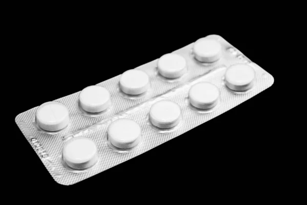 Białe Opakowanie Tabletkami Czarnym Tle Zbliżenie — Zdjęcie stockowe