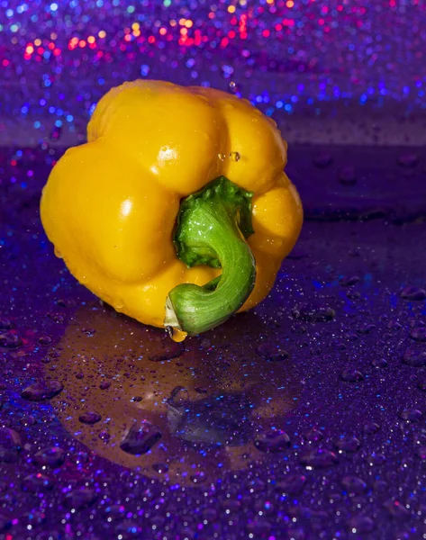 wet big yellow pepper in a spark