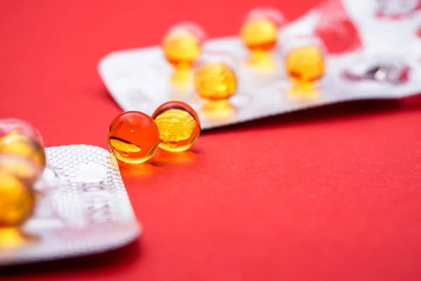 Yellow Pills Blister Pack Close Red Background — Stock Photo, Image