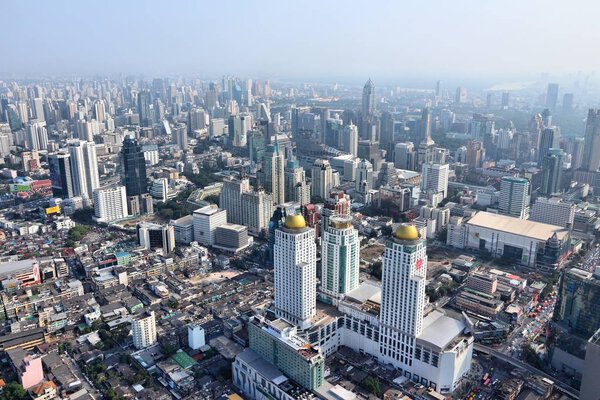BANGKOK, THAILAND - DECEMBER 24, 2013: Aerial view of modern architecture in Bangkok. Bangkok is the biggest city in Thailand with 14 million people living in its urban area.