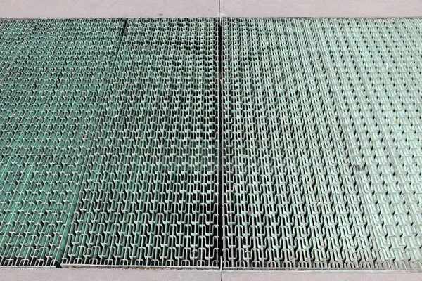 Metal sidewalk grating — Stock Photo, Image