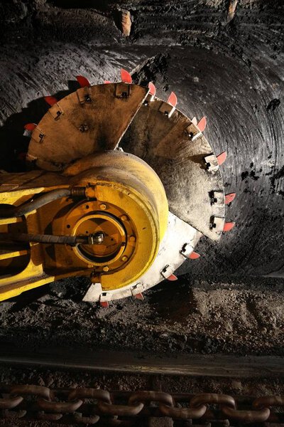 Poland coal mine interior - underground tunnel. Industry in Zabrze, Upper Silesia. Longwall mining shearer machine.