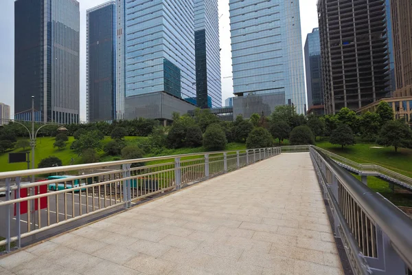 Empty road surface with modern city buildings background — Stock Photo, Image