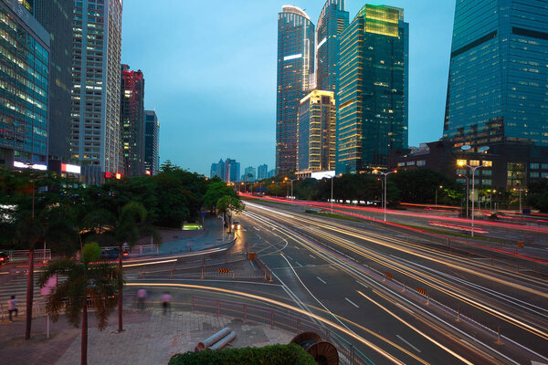 Empty road surface floor with modern city landmark architecture backgrounds of night scene in Shenzhen China