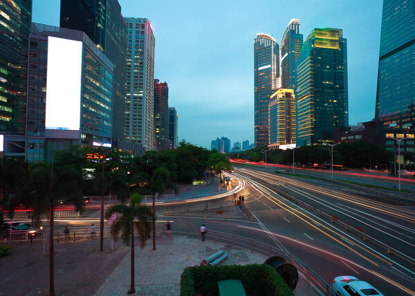 Empty road surface floor with modern city landmark architecture backgrounds of night scene in Shenzhen China