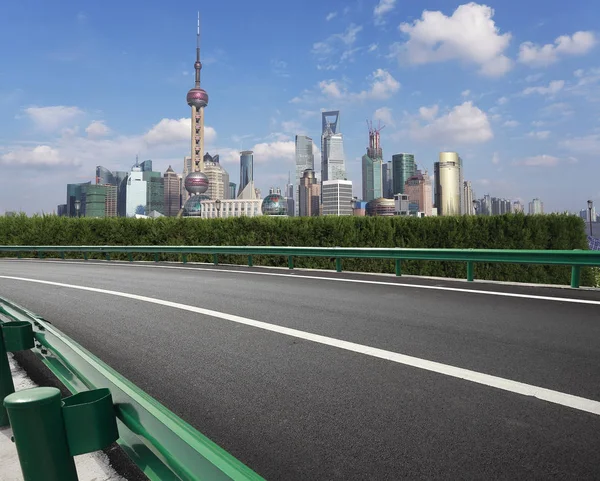 Empty road surface with shanghai bund city buildings — Stock Photo, Image