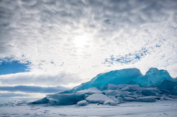 Endless blue ice hummocks in winter on the frozen Lake Baikal