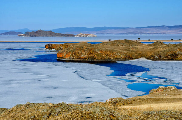 View above big beautiful lake Baikal with Ice floes floating on the water, Russia
