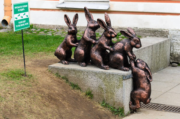 PETERSBURG, RUSSIA-May 5, 2015: Hares during the flood. Sculpture of the rabbits in Peter and Paul Fortress on Hare Island.