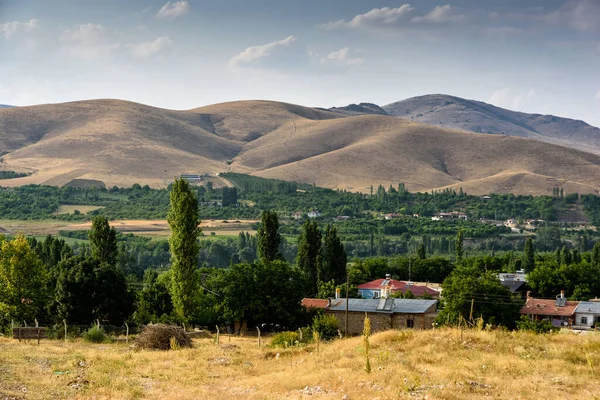 Village close the Turkish national Park aladag with mountain background behind with clouds on the sky, Turkey — Stock Photo, Image