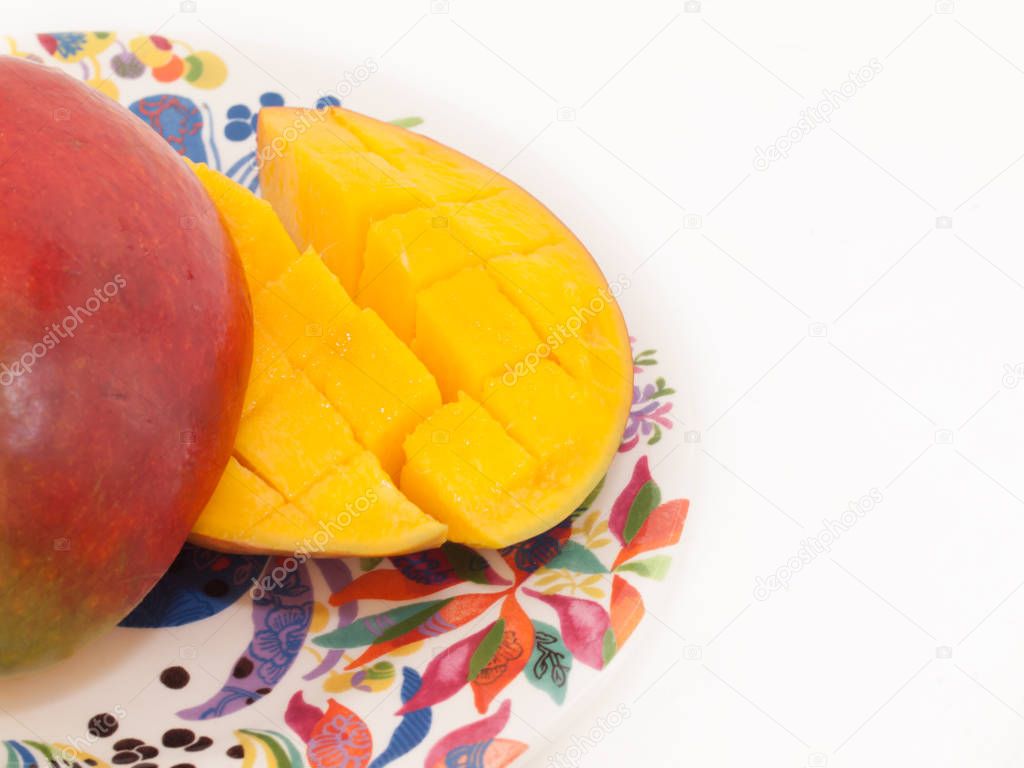 Ripe Mango with slices on plate. close up