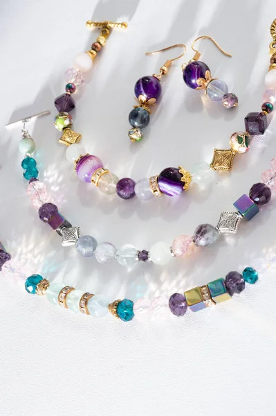 Gold jewelry bracelet with semiprecious and crystal at white bac — ストック写真