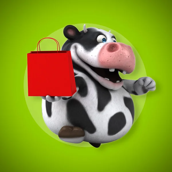 Корова с подарочным пакетом — стоковое фото