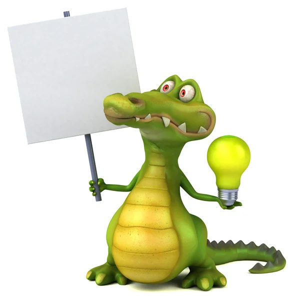 Веселый крокодил держит лампочку — стоковое фото