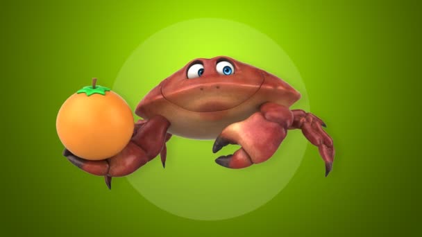Krabba holding orange — Stockvideo