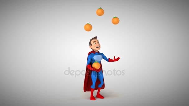 Super héroe haciendo malabares con naranjas — Vídeos de Stock