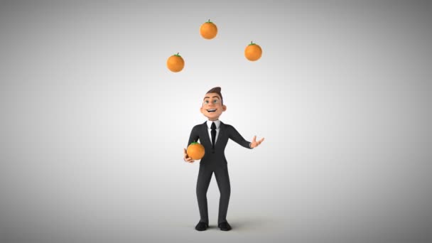 Homme d'affaires jonglant avec des oranges — Video