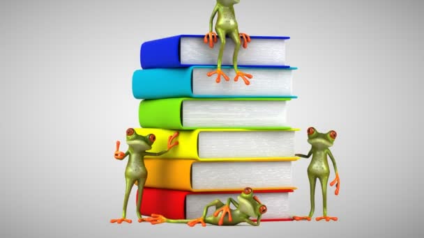 3D zelené žáby vedle knih