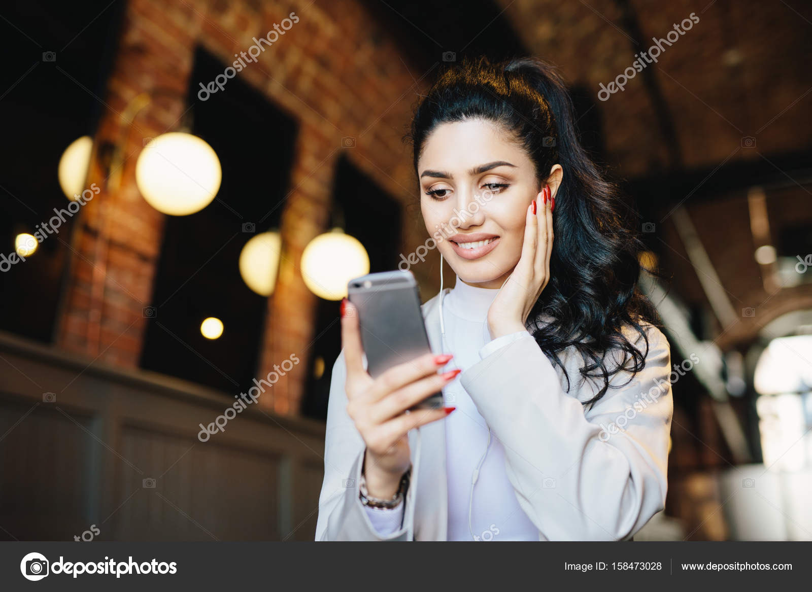 Lovely Lady With Dark Hair, Make-Up And Wonderful Manicure Wearing.