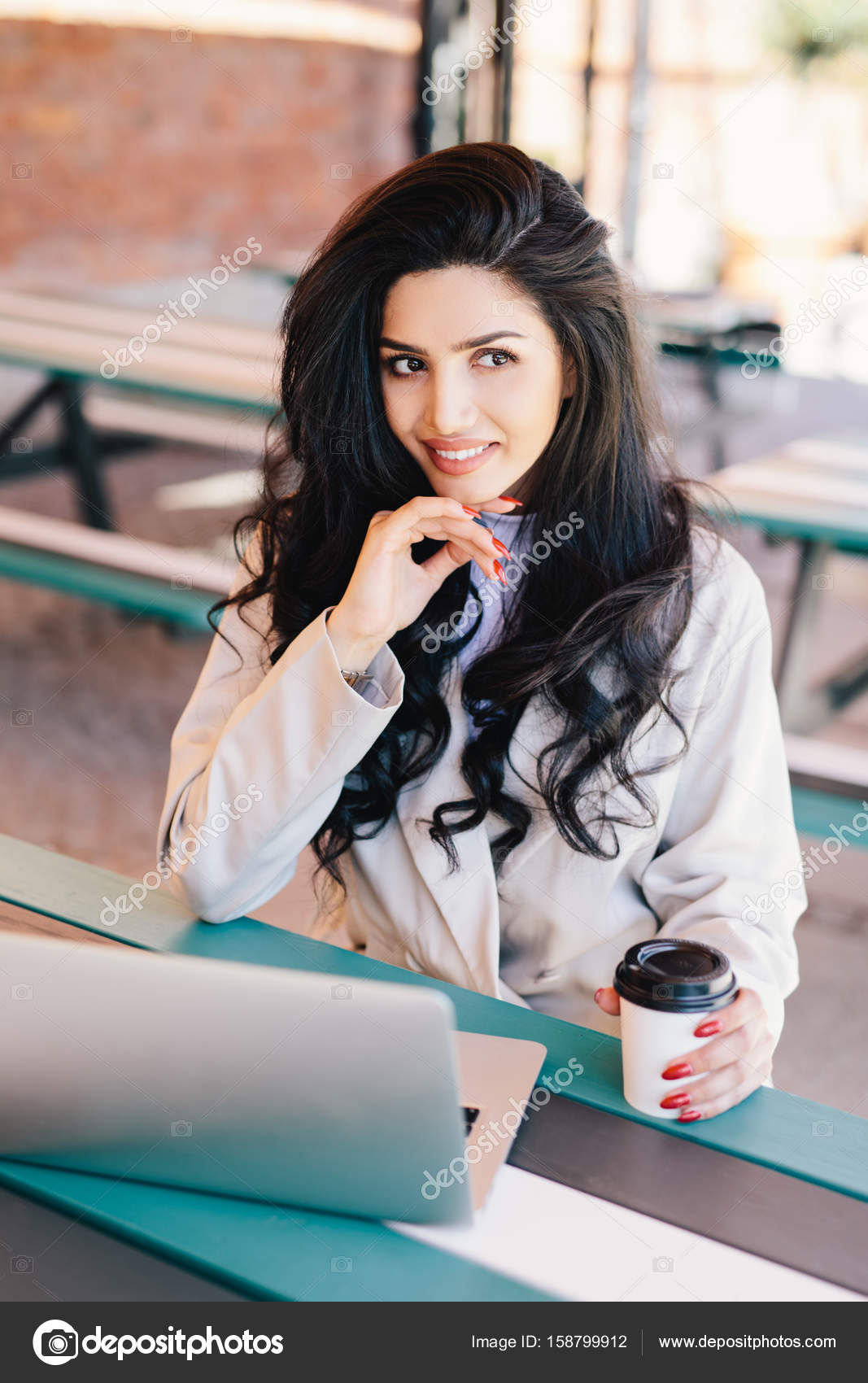 Caucasian Young Female Freelancer With Long Wavy Hair Having Dark