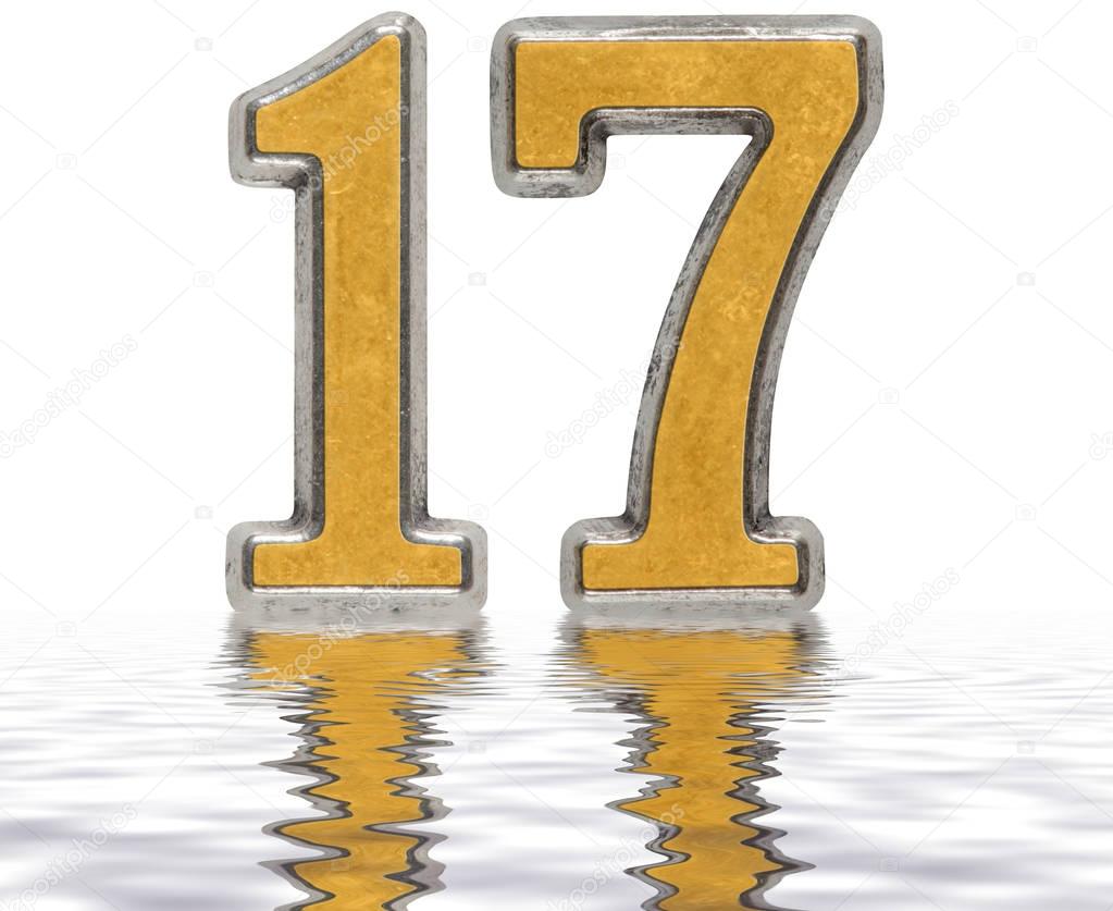 Numeral 17, seventeen, reflected on the water surface, isolated 