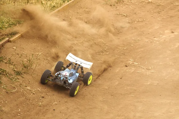 Radio controlled car model in race on dirt track — Stock Photo, Image