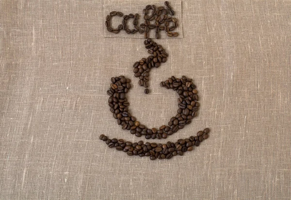 Жареные кофейные зёрна, лен, слово кофе на итальянском языке, кофе, открытка, чашка кофе , — стоковое фото